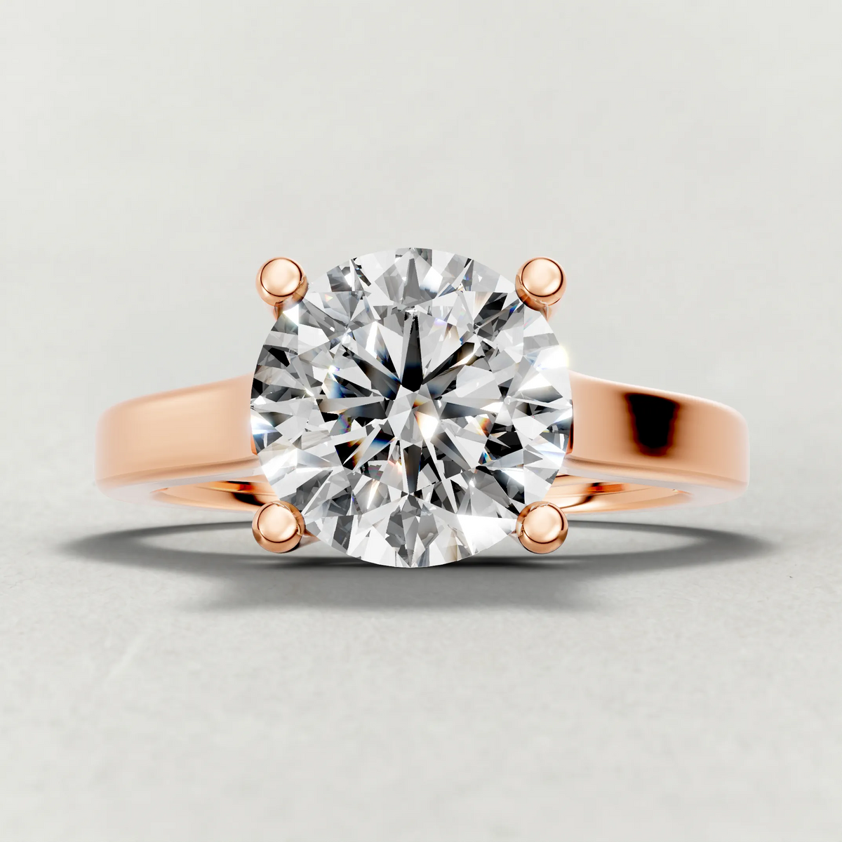 Swept Shoulder Solitaire Engagement Ring (0644) in Rose Gold zoomed in on diamond