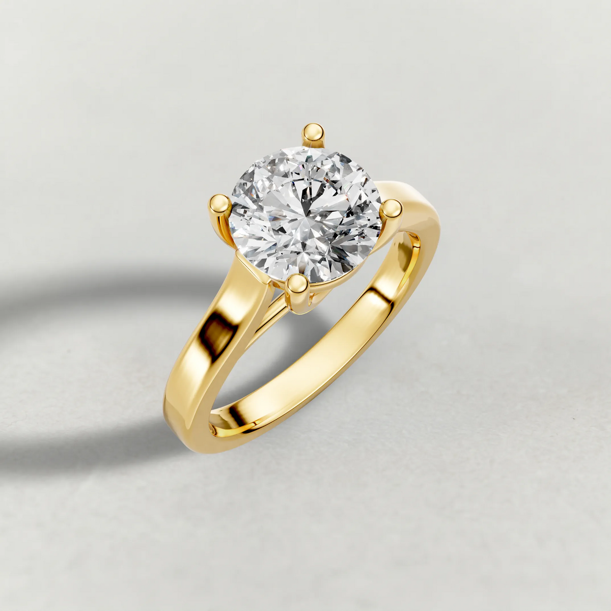 Swept Shoulder Solitaire Engagement Ring (0644) in Yellow Gold from top 3/4 angle