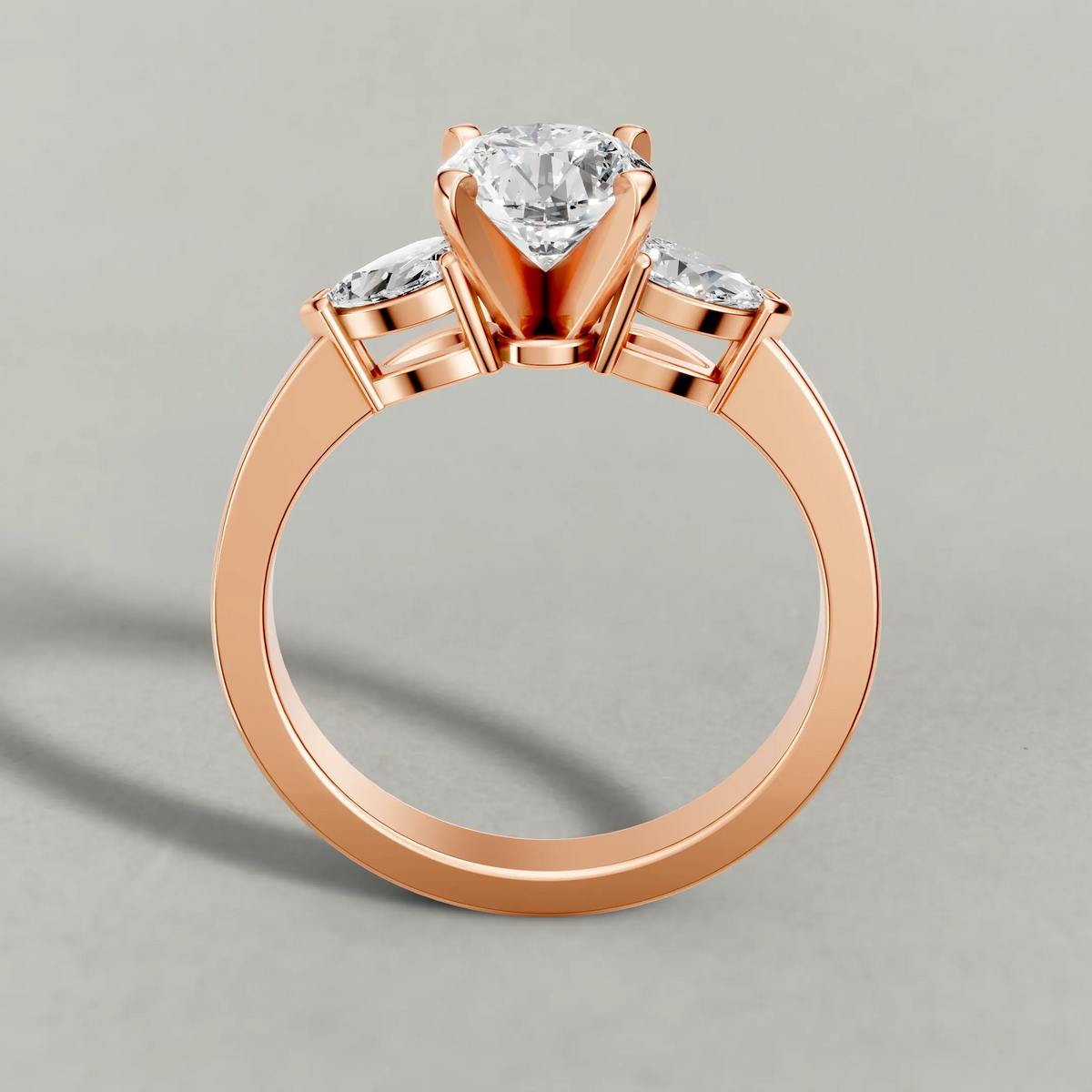 Three-Stone Side-Stone Engagement Ring (2046) in Rose Gold from front angle