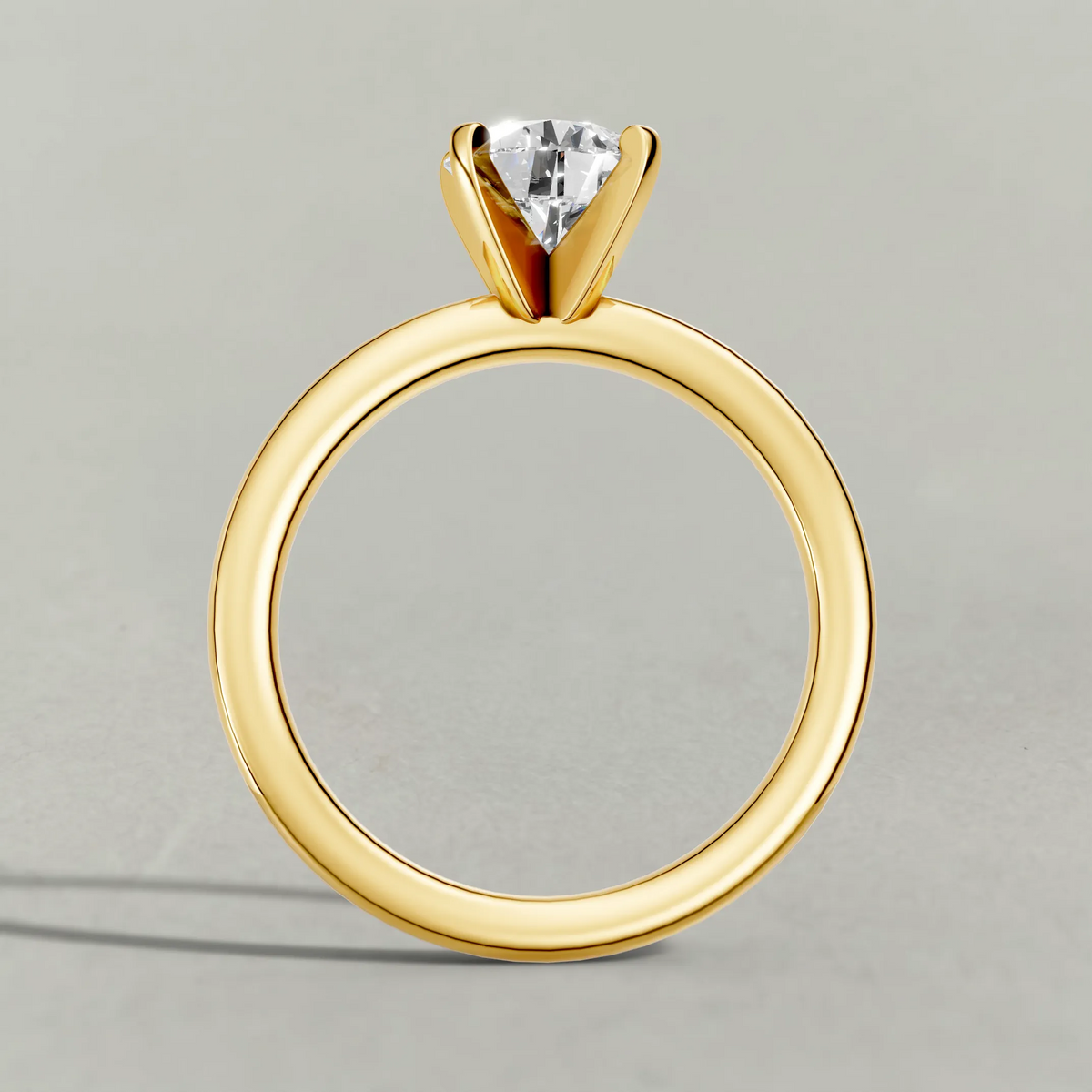 Petite Basket Solitaire Engagement Ring (3905) in Yellow Gold from front angle