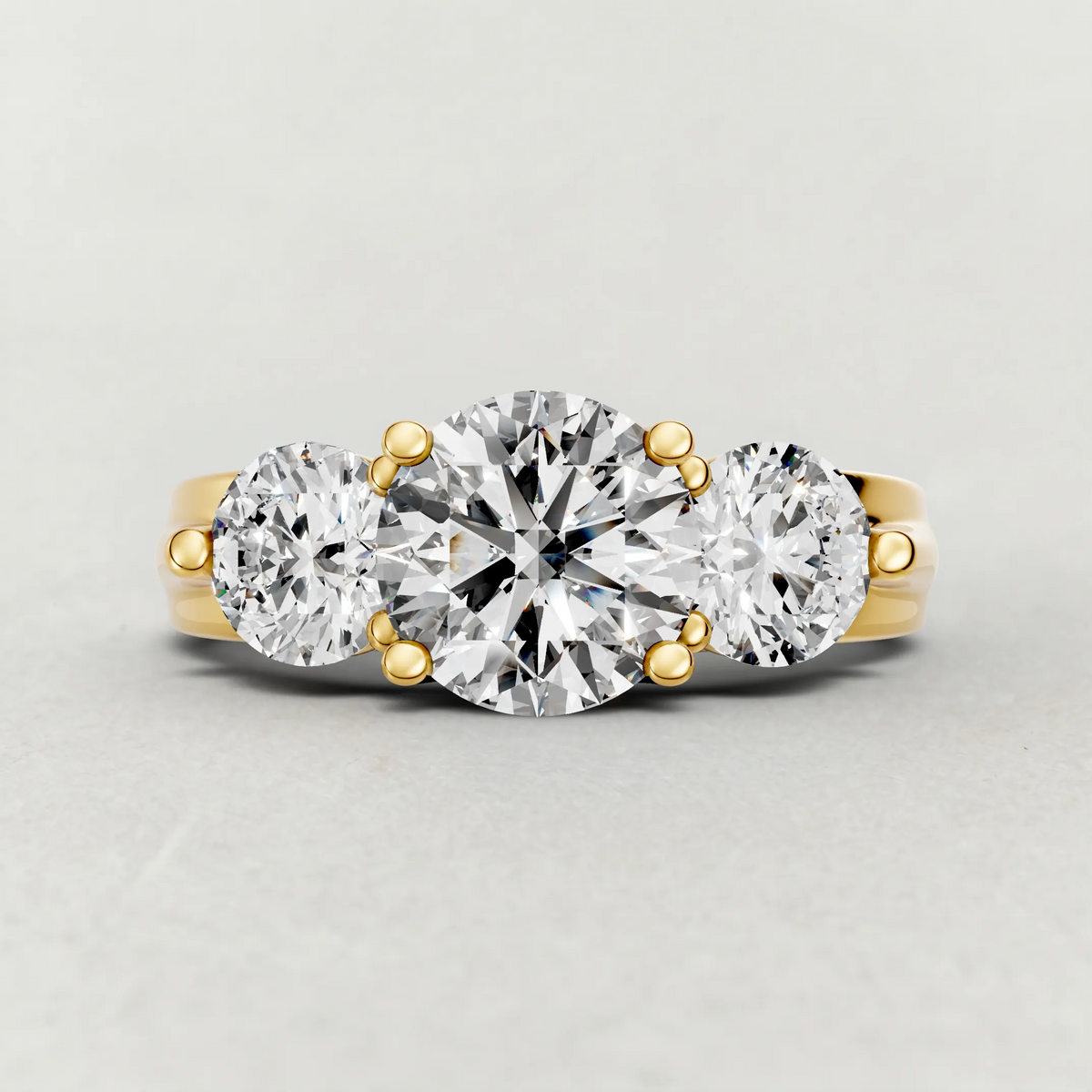 Sculpted Three-Stone Diamond Engagement Ring (3988) in Yellow Gold zoomed in on diamond