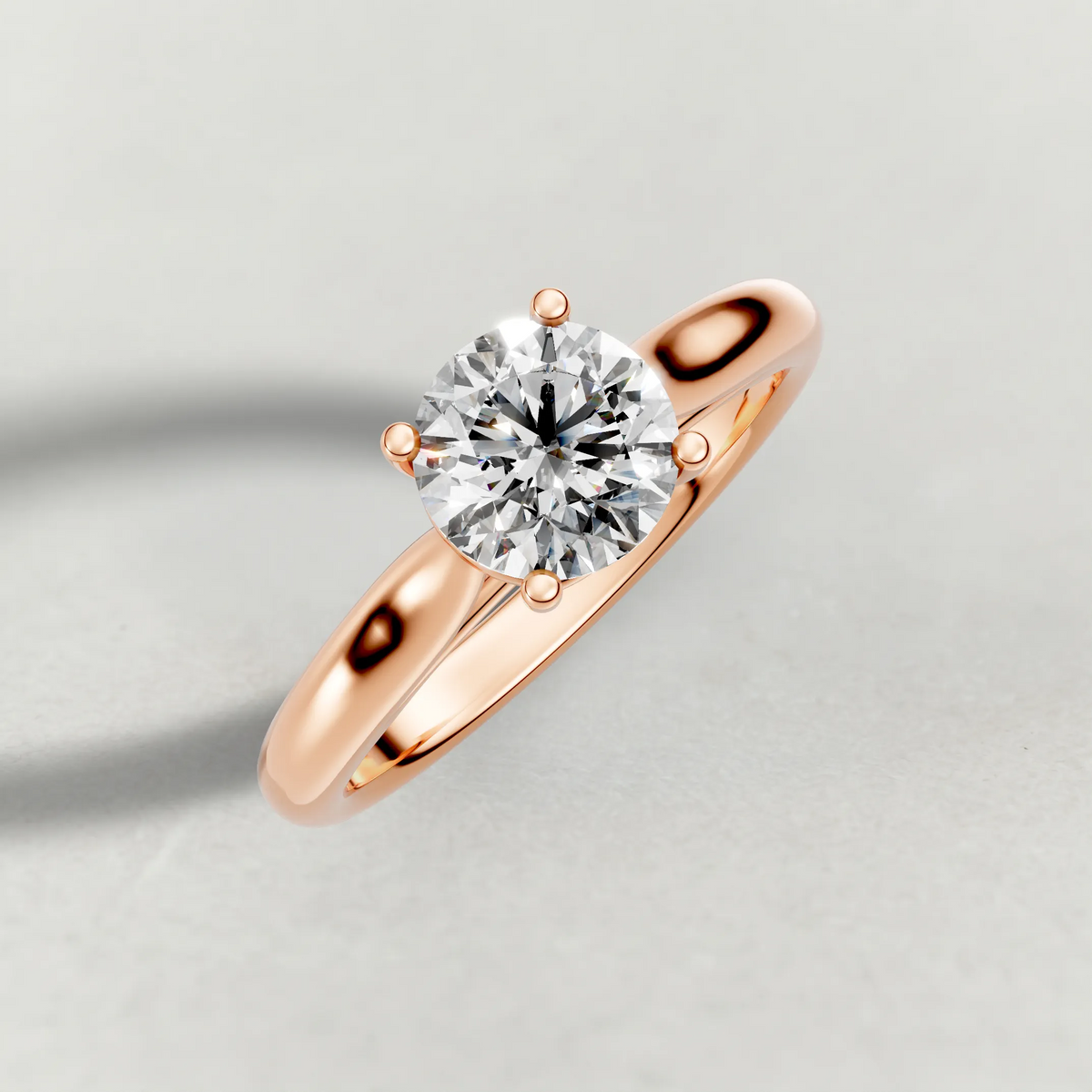 Tapered Four-Prong Solitaire Engagement Ring (70686) in Rose Gold from top 3/4 angle