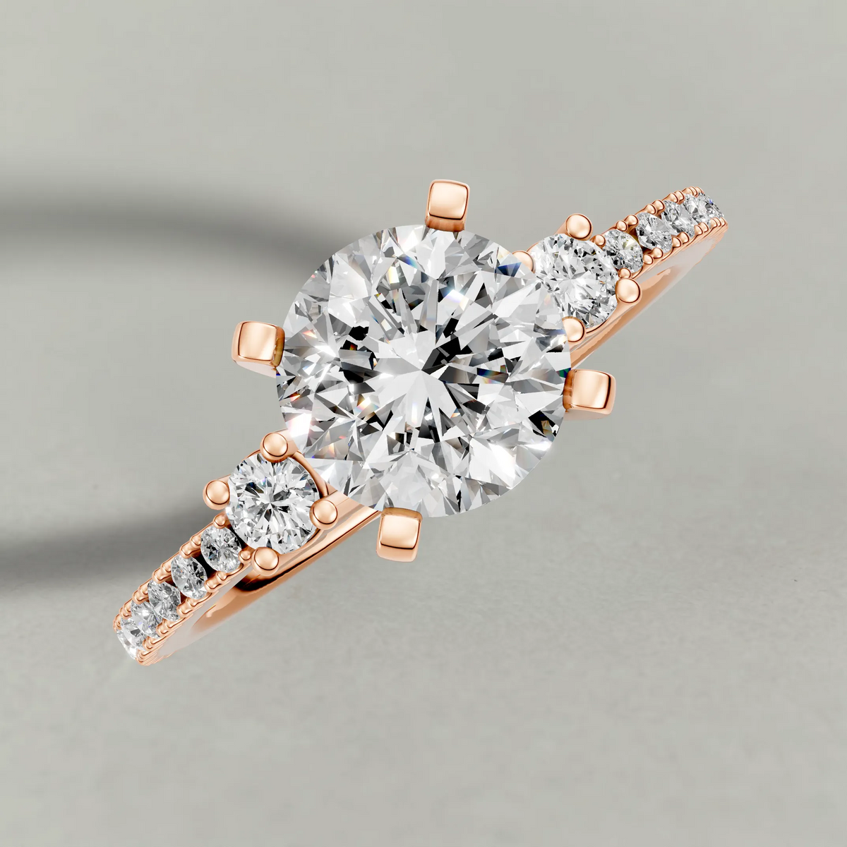 Three-Stone Pavé Engagement Ring (70857) in Rose Gold from top 3/4 angle