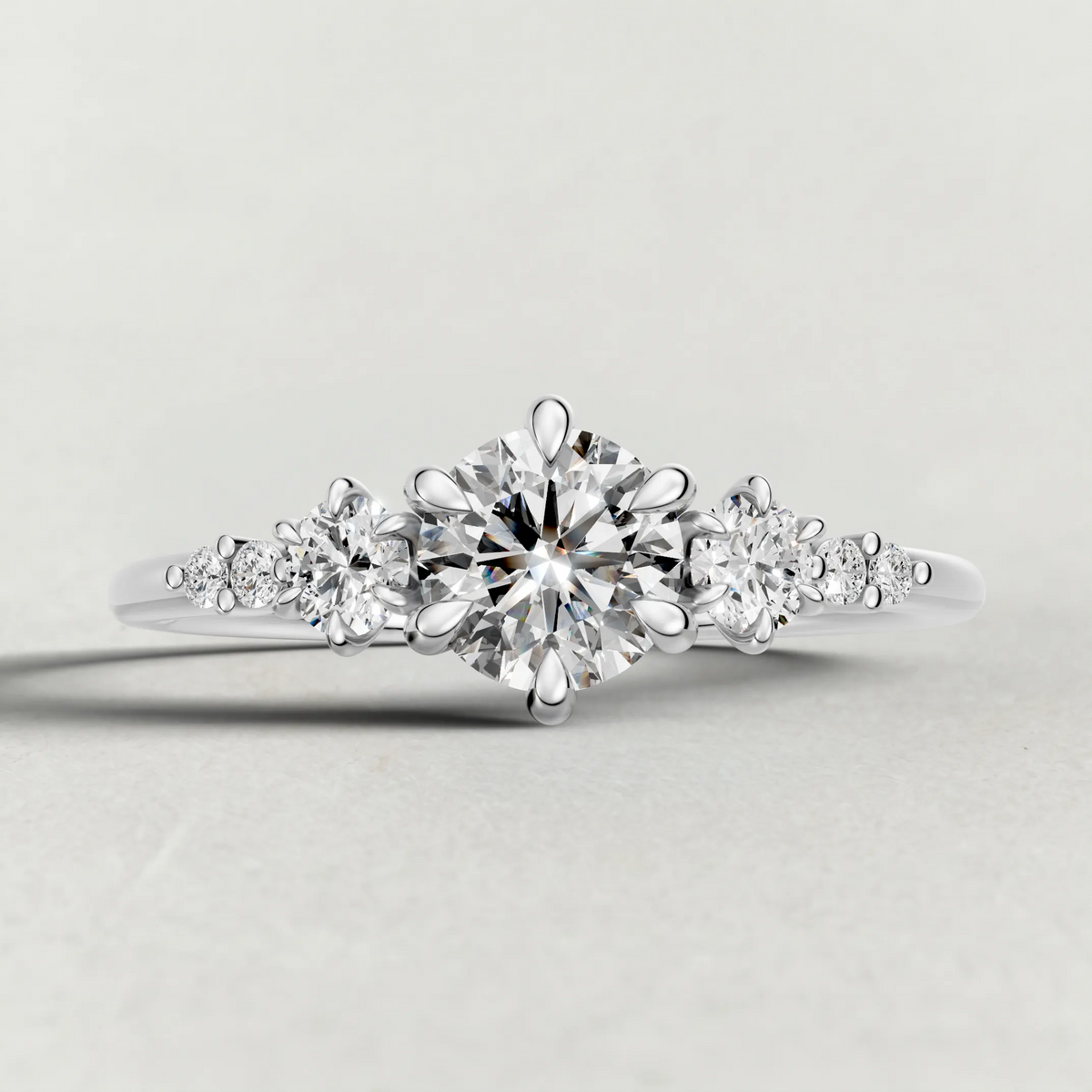 Graduated Side-Stone Engagement Ring (72084) in White Gold zoomed in on diamond