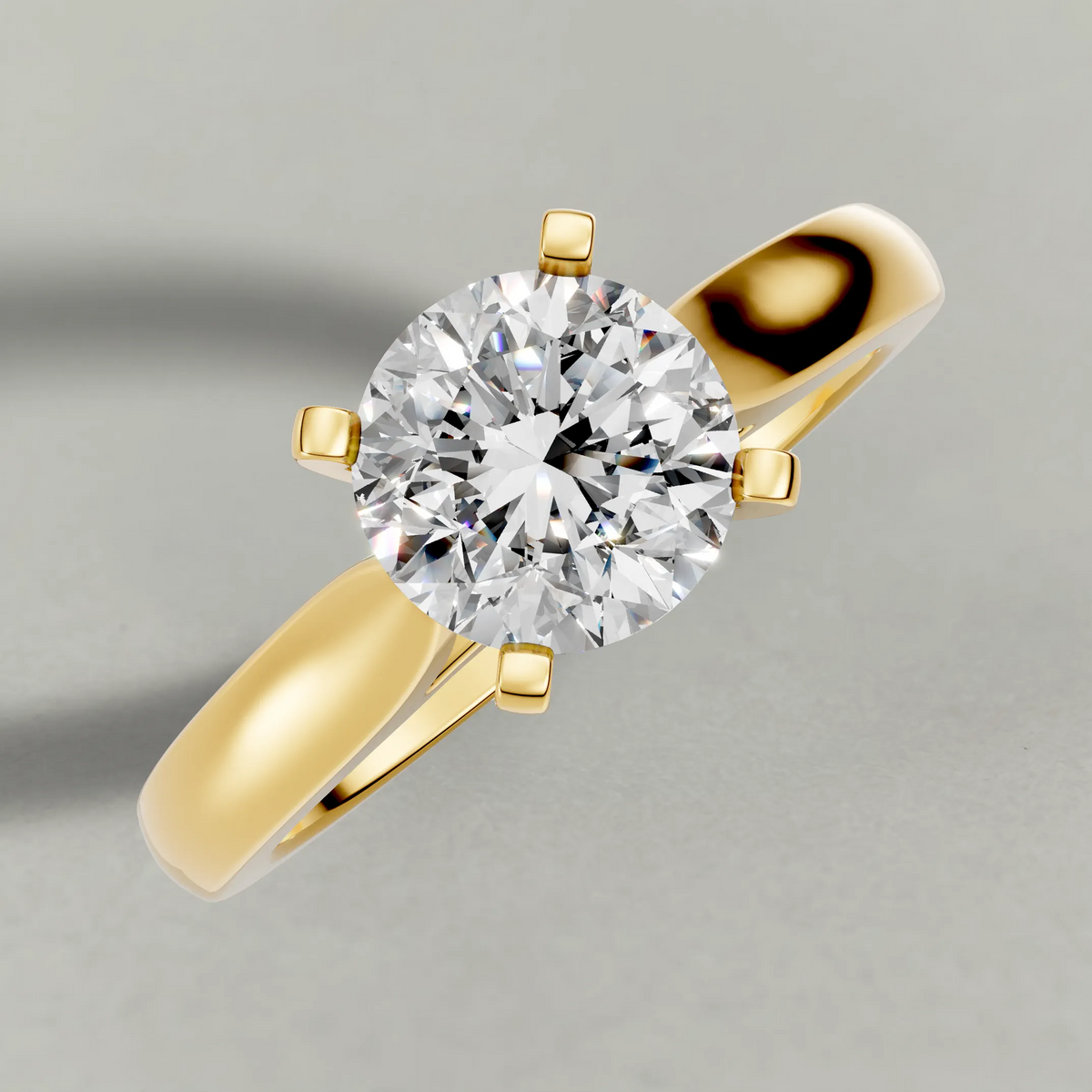 Tapered Cathedral Solitaire Engagement Ring (7587) in Yellow Gold from top 3/4 angle