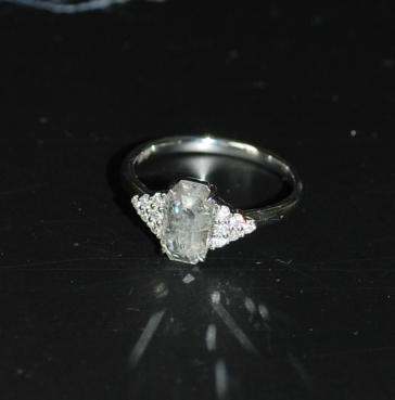 Diamond ring with reflection on surface