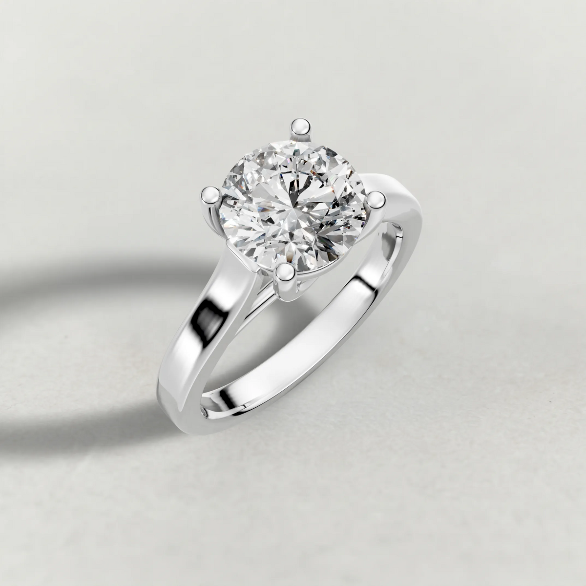 Swept Shoulder Solitaire Engagement Ring (0644) in White Gold from top 3/4 angle