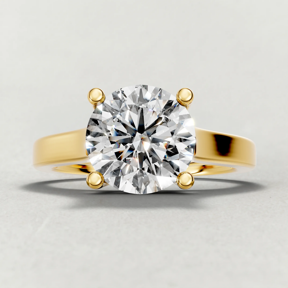 Swept Shoulder Solitaire Engagement Ring (0644) in Yellow Gold zoomed in on diamond