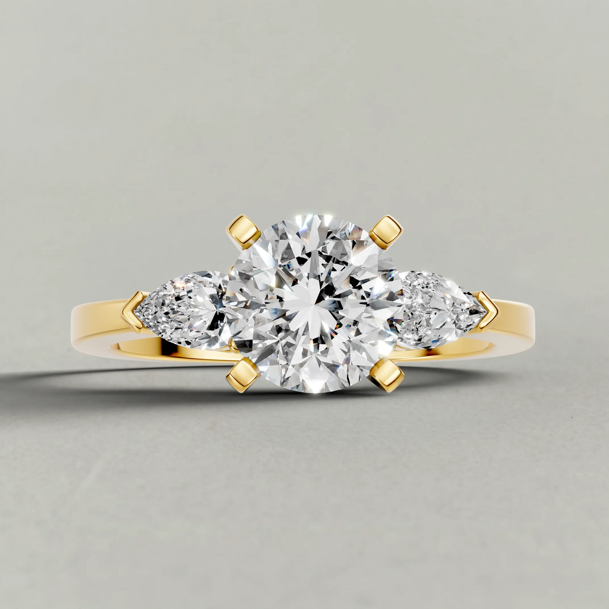 Three-Stone Side-Stone Engagement Ring (2046) in Yellow Gold zoomed in on diamond