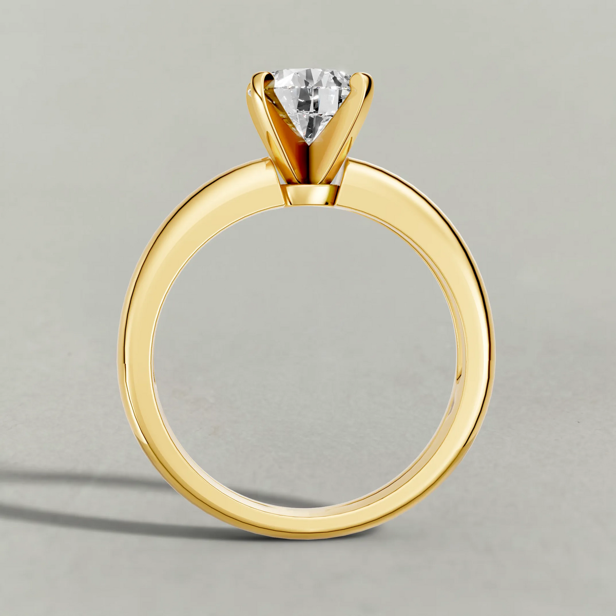 Wide Tapered Solitaire Engagement Ring (3808) in Yellow Gold from front angle