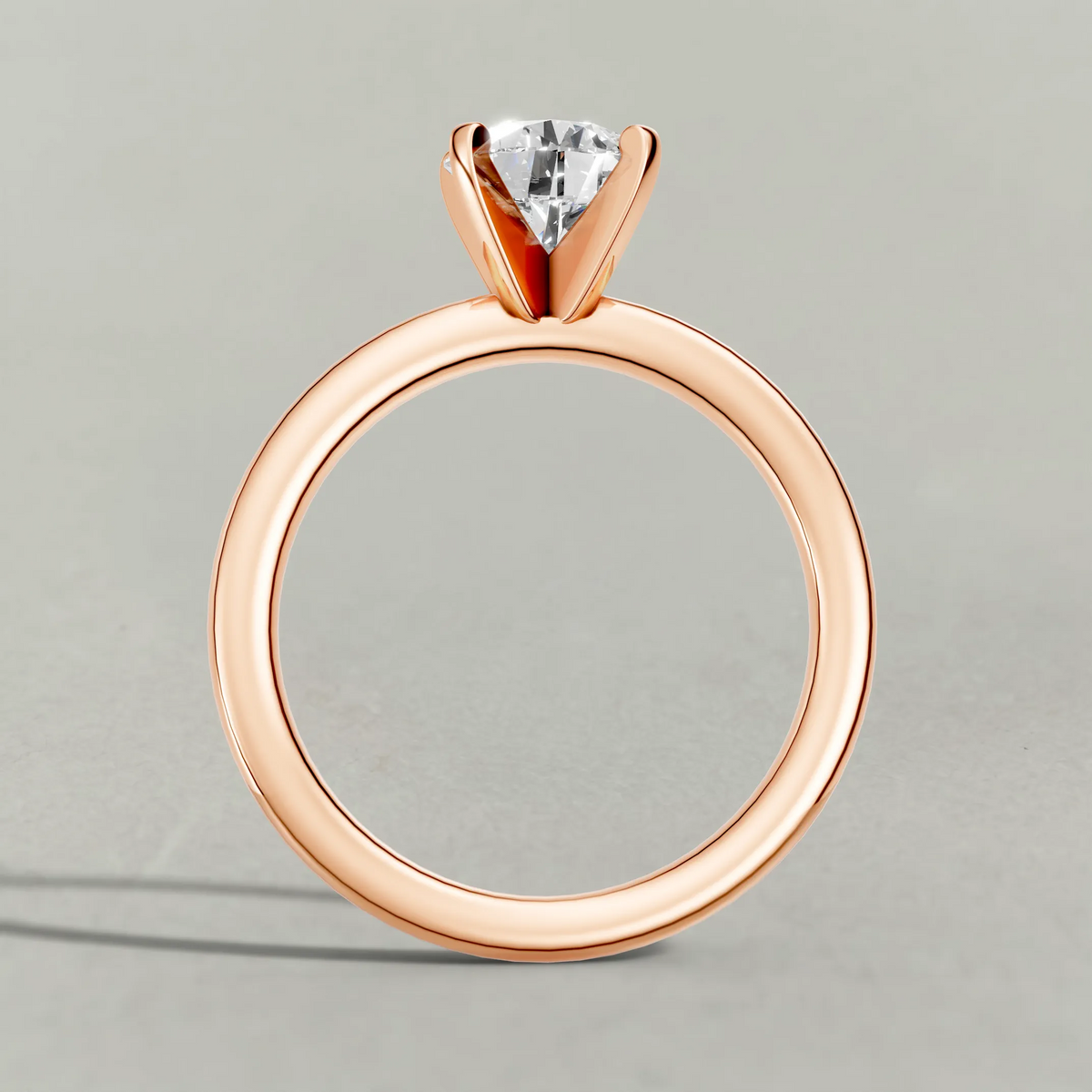Petite Basket Solitaire Engagement Ring (3905) in Rose Gold from front angle