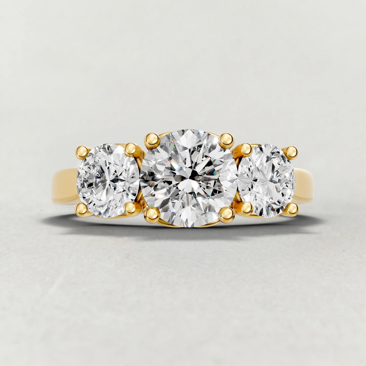 Three-Stone Side Diamond Engagement Ring (70673) in Yellow Gold zoomed in on diamond