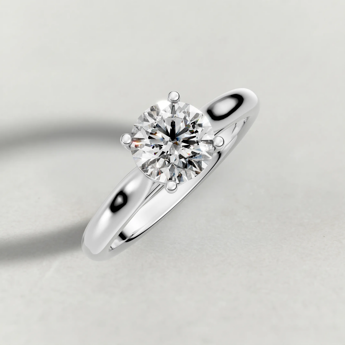 Tapered Four-Prong Solitaire Engagement Ring (70686) in Platinum from top 3/4 angle