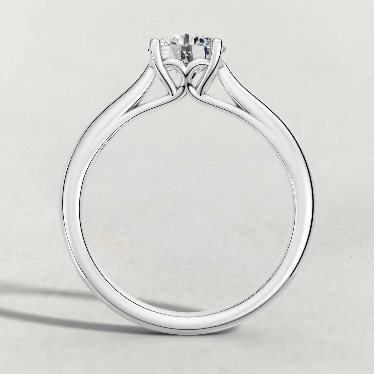 Tapered Four-Prong Solitaire Engagement Ring (70686) in White Gold from front angle