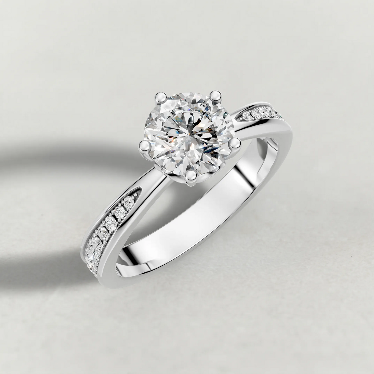 Delicate Pavé Shoulder Solitaire Engagement Ring (70887) in White Gold from top 3/4 angle