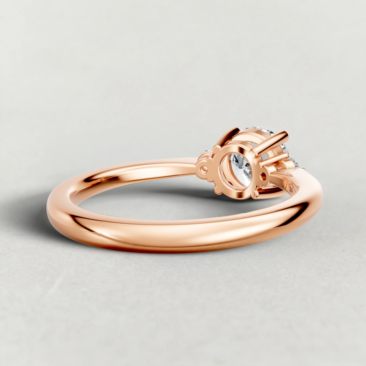 Diamond Accent Shoulder Solitaire Engagement Ring (70934) in Rose Gold from back angle