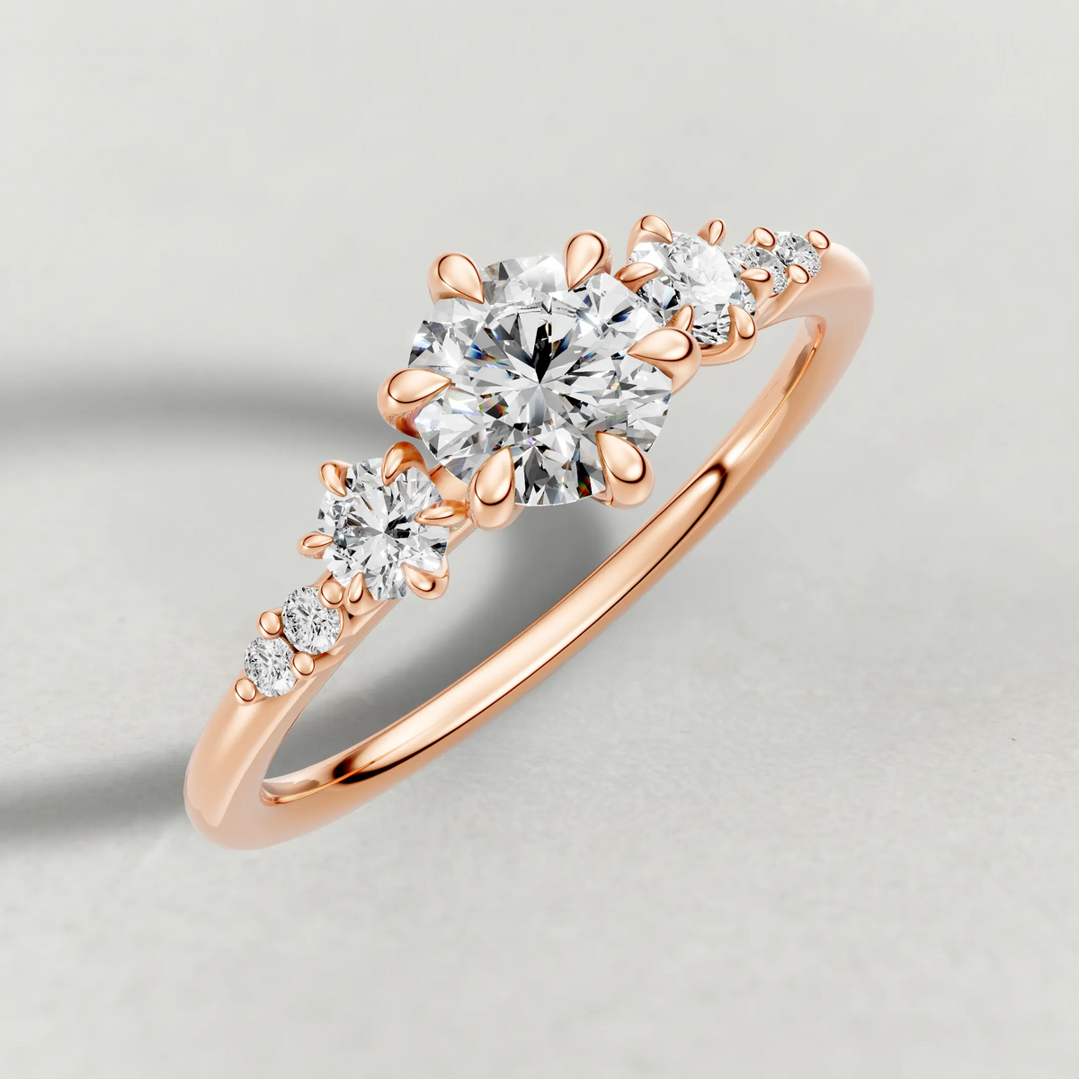 Graduated Side-Stone Engagement Ring (72084) in Rose Gold from top 3/4 angle