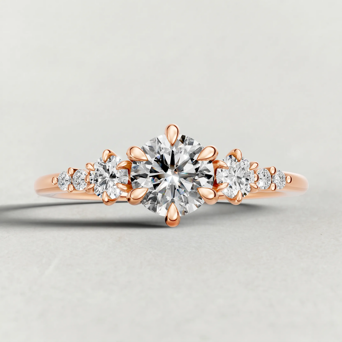 Graduated Side-Stone Engagement Ring (72084) in Rose Gold zoomed in on diamond