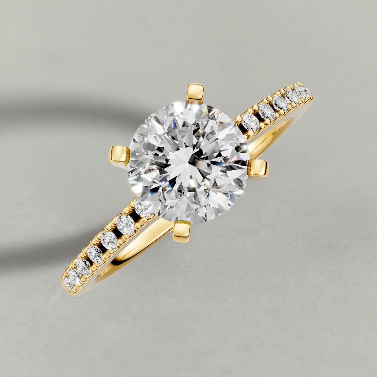 Tapered Pavé Shoulder Engagement Ring (7504) in Yellow Gold from top 3/4 angle