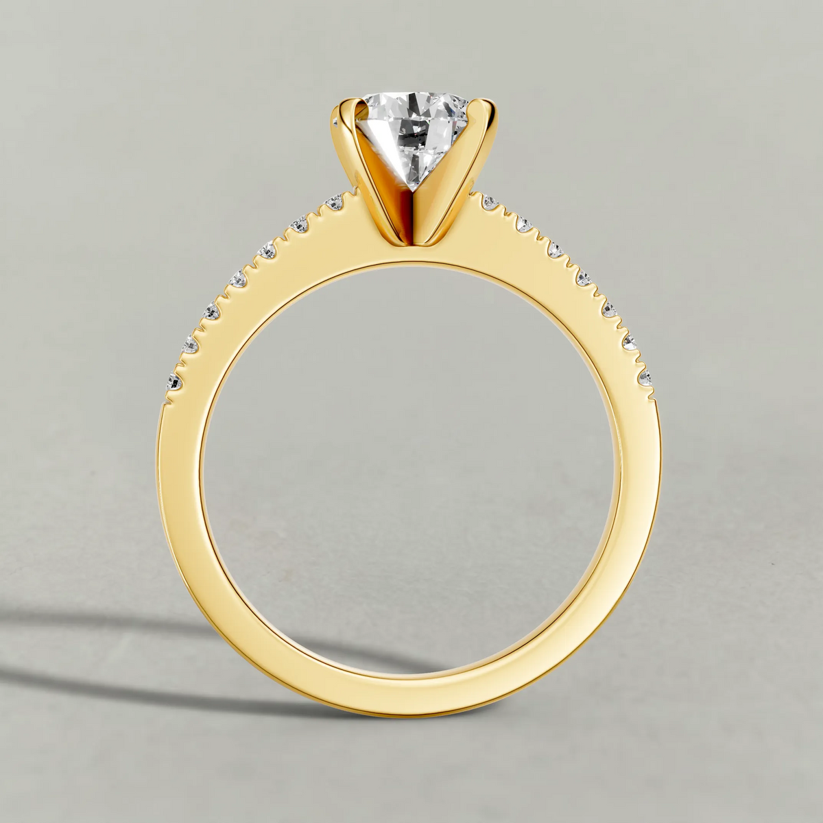 Tapered Pavé Shoulder Engagement Ring (7504) in Yellow Gold from front angle
