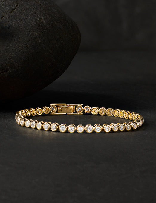 Yellow gold tennis bracelet with bezel-set round diamonds