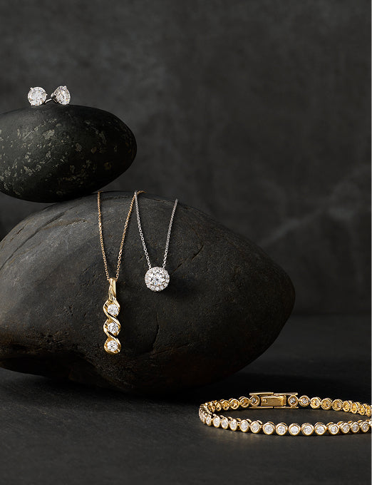 Diamond studs, twist and halo pendants,  and yellow gold tennis bracelet