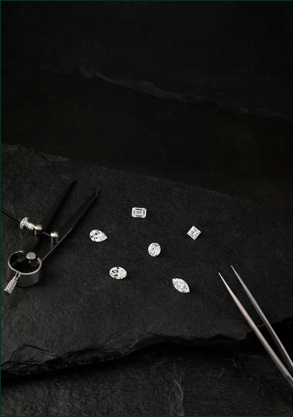 Portrait image of emerald, pear, princess, round, oval and marquise diamonds with tools