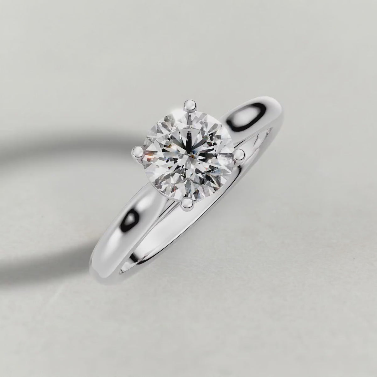 Rotating Tapered Four-Prong Solitaire Engagement Ring (70686) in White Gold