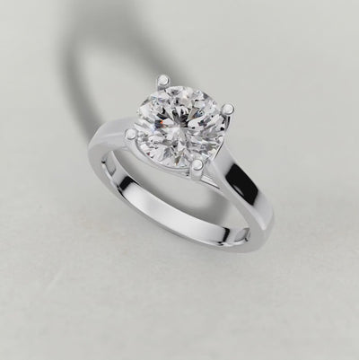Rotating Swept Shoulder Solitaire Engagement Ring (0644) in White Gold